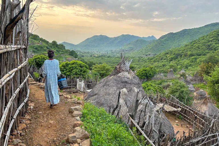 A narrow path within the village of Lohobohobo, where rainmaker Solomon Oture was buried alive in October 2024 [Adlai Coleman/Al Jazeera]