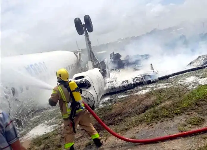 Firefighter at the scene where a plane crash landed in Mogadishu on Monday, July 18, 2022 (Twitter / Asmali)