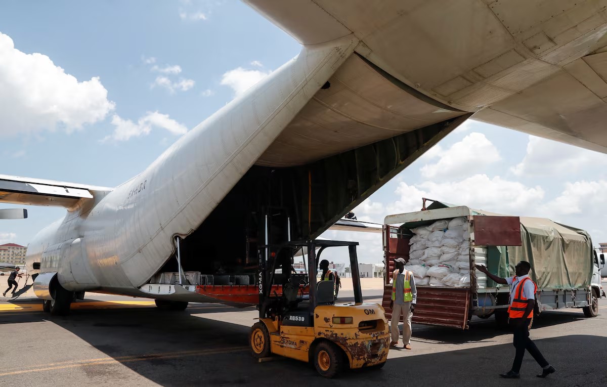 Workers load food aid in a cargo plane for delivery within Ulang and Nasir counties in Upper Nile State ravaged by fighting between local militiamen and the army, in an operation run by Fogbow, a U.S. company organising the airdrops with funding from the South Sudanese government, at the Juba International airport in Juba, South Sudan June 9, 2025 (REUTERS/Thomas Mukoya)