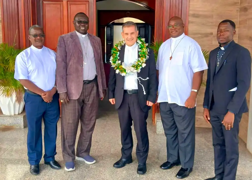Group Photo of Monsignor Marco Ganci, Bishop Santo Loku Pio and the priests who received him (Photo Credit: The Association of Member Episcopal Conferences in Eastern Africa [AMECEA])