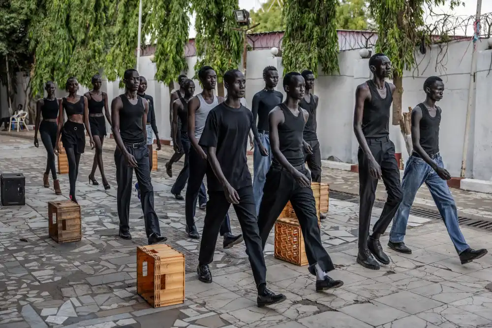 Professional models from the Juba-based modelling agency Jubalicious practise their catwalking during a modelling training session at a hotel in Juba on February 19, 2026 (Credits: LUIS TATO / AFP)