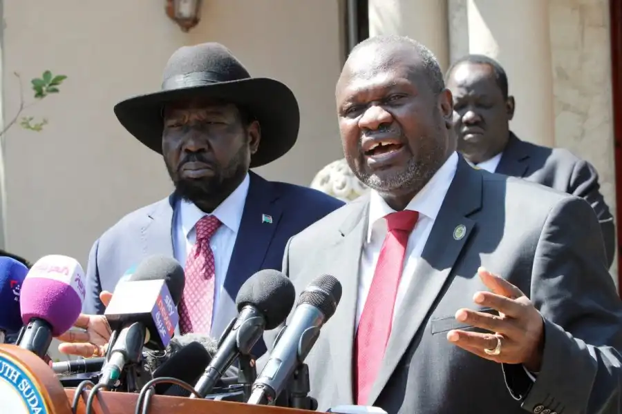 Riek Machar, speaks during a news statement with South Sudan's President Salva Kiir Mayardit (L) after their meeting in which they have reached a deal to form a long-delayed unity government in Juba, South Sudan December 17, 2019 (Photo Credit: REUTERS/Jok Solomun/File Photo)