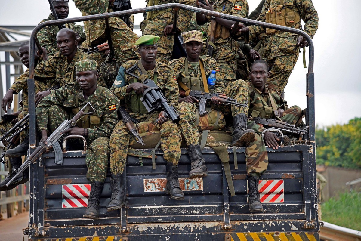 Soldiers from the Uganda Peoples Defense Forces patrol the border with South Sudan (PHOTOGRAPH BY ANTHONY NAMBWAYA-REUTERS)