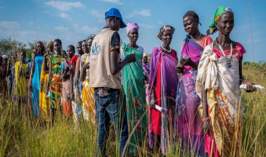 South Sudanese women queue for food rations at a World Food Programme distribution site run by Catholic Relief Services in Jonglei State, South Sudan, Wednesday, Nov. 13, 2024 (Photo credit: Florence Miettaux via AP)