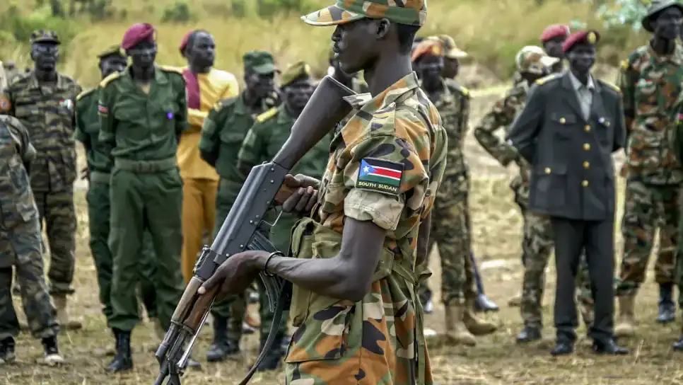 A south Sudanese soldier monitors area as troops belonging to South Sudanese Unified Forces take part in a deployment ceremony at the Luri Military Training Centre in Juba, on 15 November 2023 (File photo/AFP)