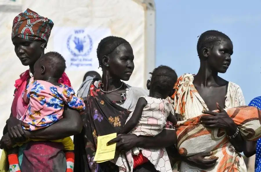 South Sudanese asylum seekers queue to receive fortified biscuits as part of WFP food assistance at the Matar refugee camp in Gambella region (Photo Credit: Vatican News)