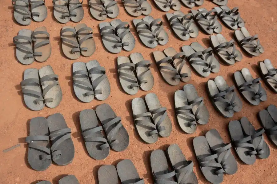 South Sudanese craft sandals from tires to survive economic collapse (Photo Credit: The Sudan Times)