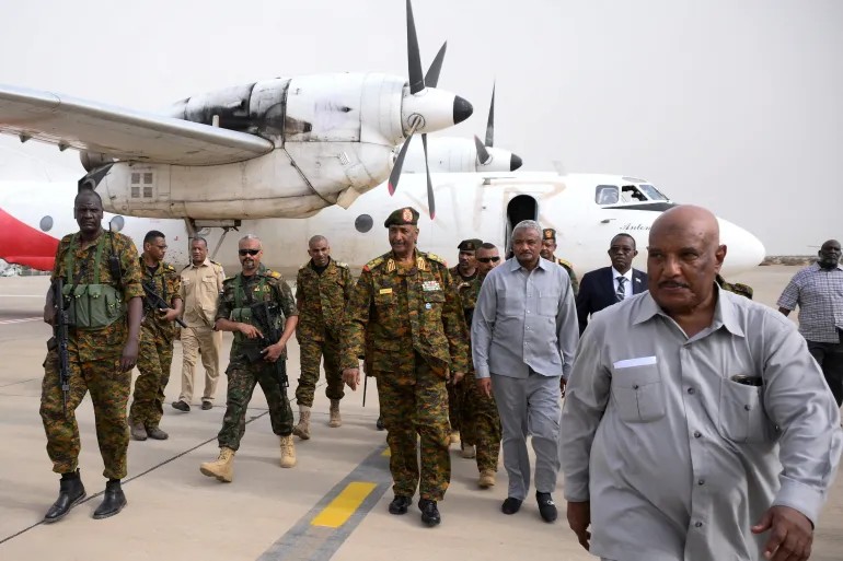 Sudanese General Abdel Fattah al-Burhan arrives with his officials and guards at the military airport of Port Sudan, Sudan, August 27, 2023 [Ibrahim Mohammed Ishak/ Reuters]