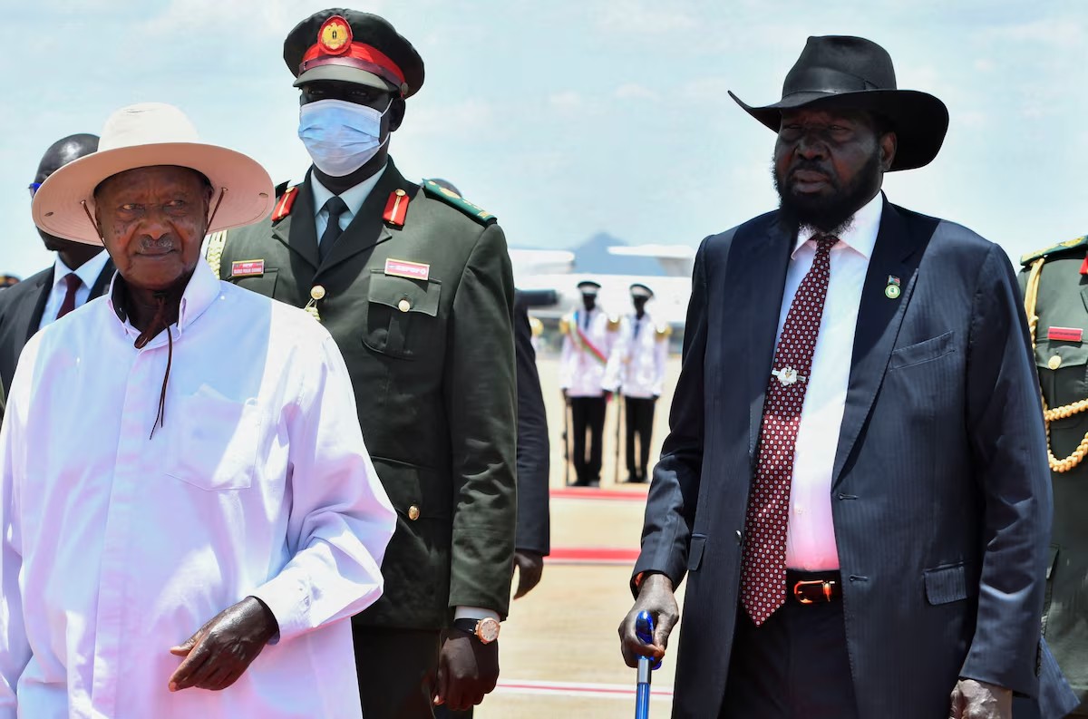Uganda's President Yoweri Museveni walks with South Sudan's President Salva Kiir upon arriving at the Juba International Airport, ahead of meetings aimed at averting a new civil war after South Sudan's First Vice President Riek Machar was placed under house arrest in Juba, South Sudan April 3