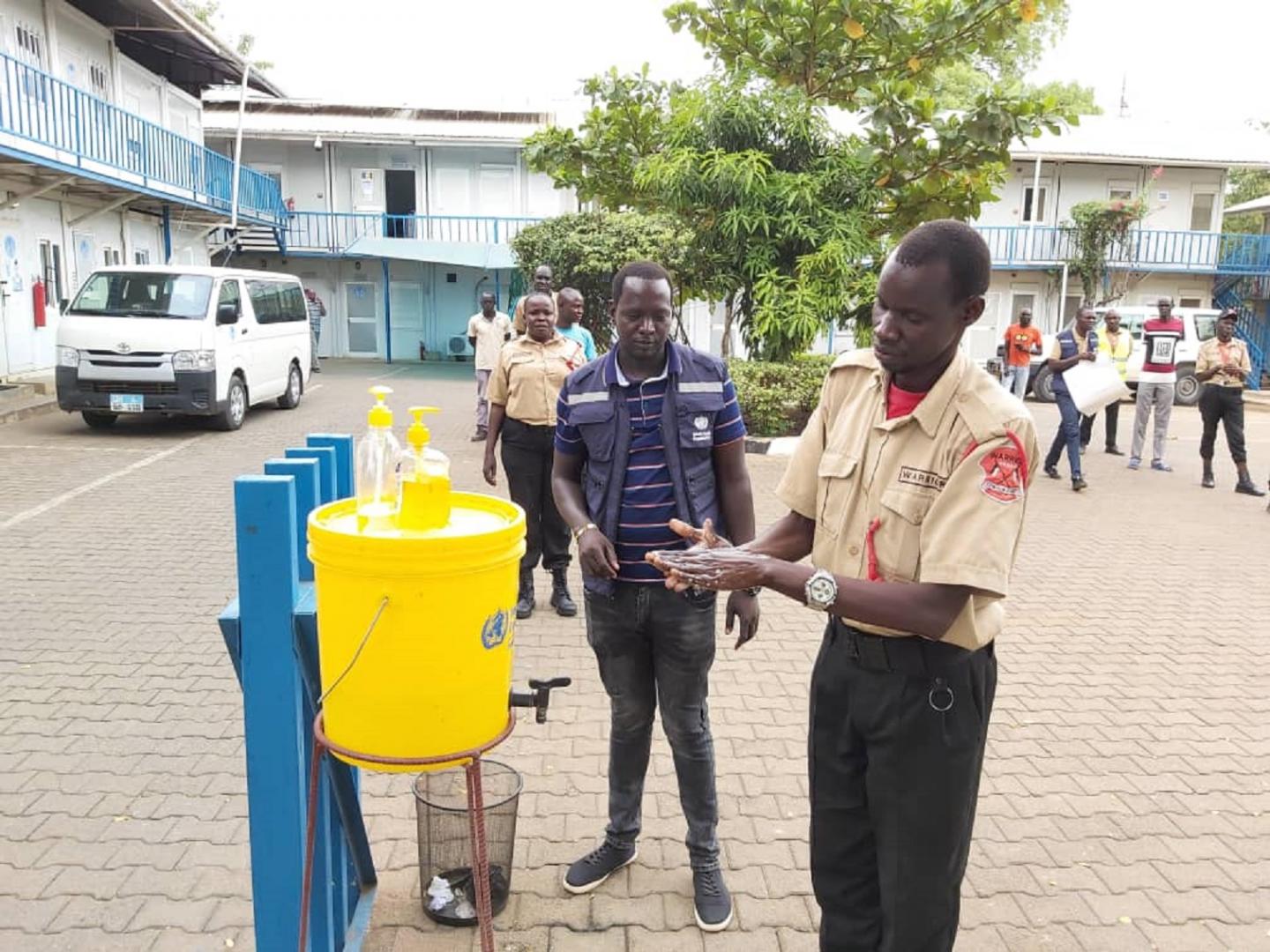 covid-19 Security guards deployed at WHO office in Juba practices hand washing as a recommended measure to prevent the spread of COVID-19 (File Image) southsudan_covid-19_Security_guards_deployed_at_WHO_office_in_Juba_practices_hand_washing_as_a_recommended_measure_to_prevent_the_spread_of_COVID-19.jpg